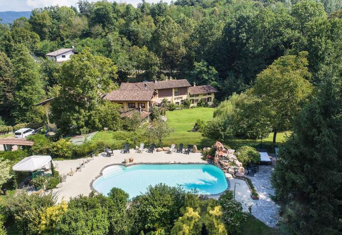 Die ca. 1850 erbaute ehemalige Mühle liegt in einer grünen Oase am Zusammenfluss zweier prealpiner Wildbäche